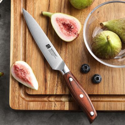 couteau  de cuisine manche en bois  pakka coupe figue en deux